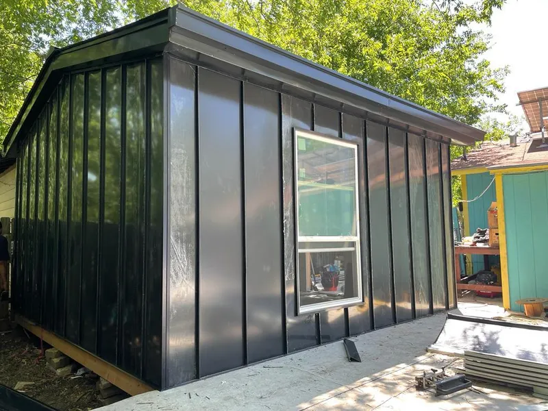 Black standing seam metal wall panels for Roof Inspection in Attica