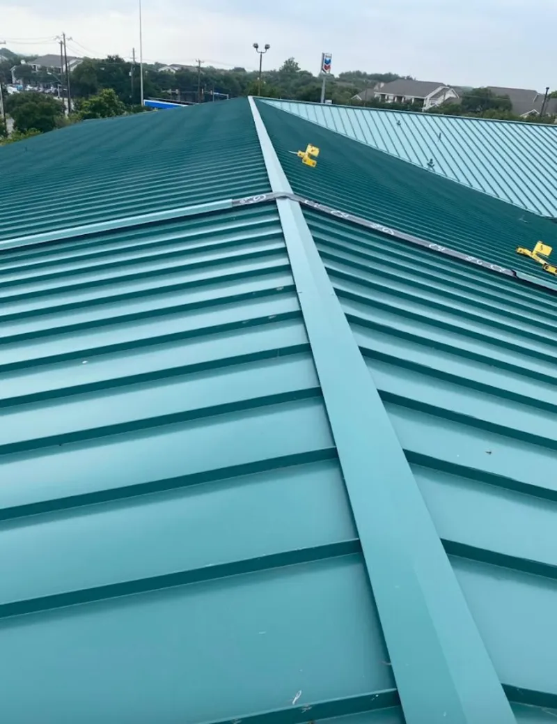 Green commercial metal roof ridge and valley for Metal Roof Repair in Attica